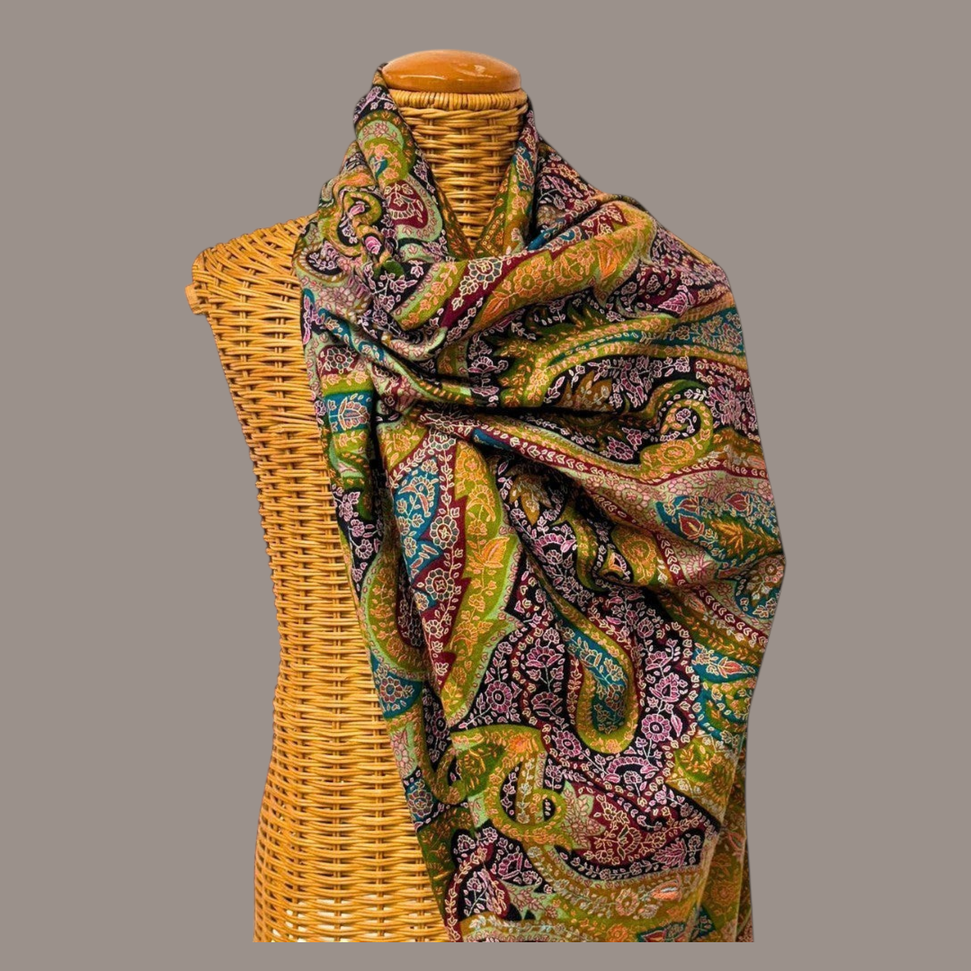 Indus Weavers Floriana Pashmina shawl featuring intricate Kalamkari painting and Sozni embroidery in green and maroon.