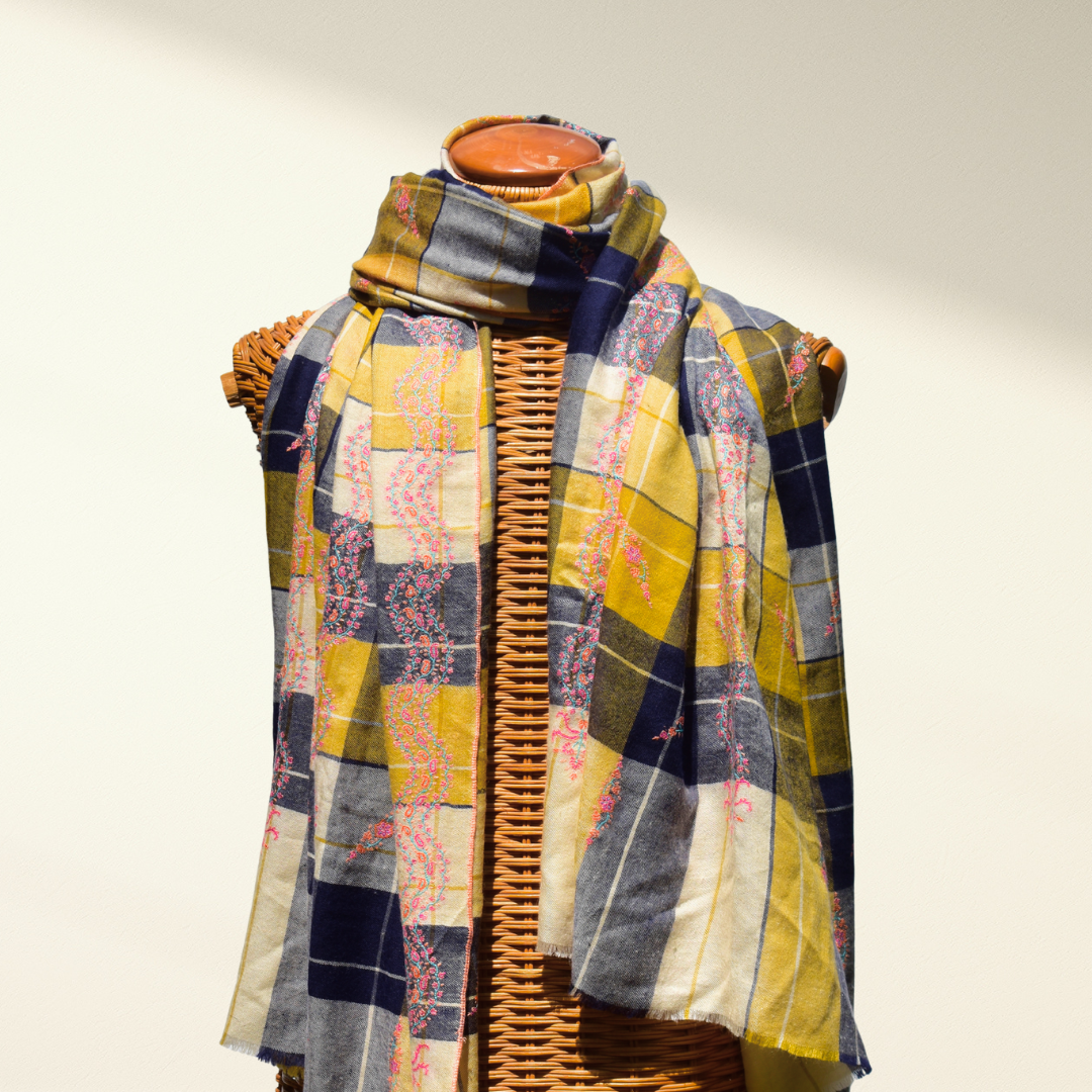 Checkered Pashmina shawl with a patchwork pattern draped over a mannequin on a white background