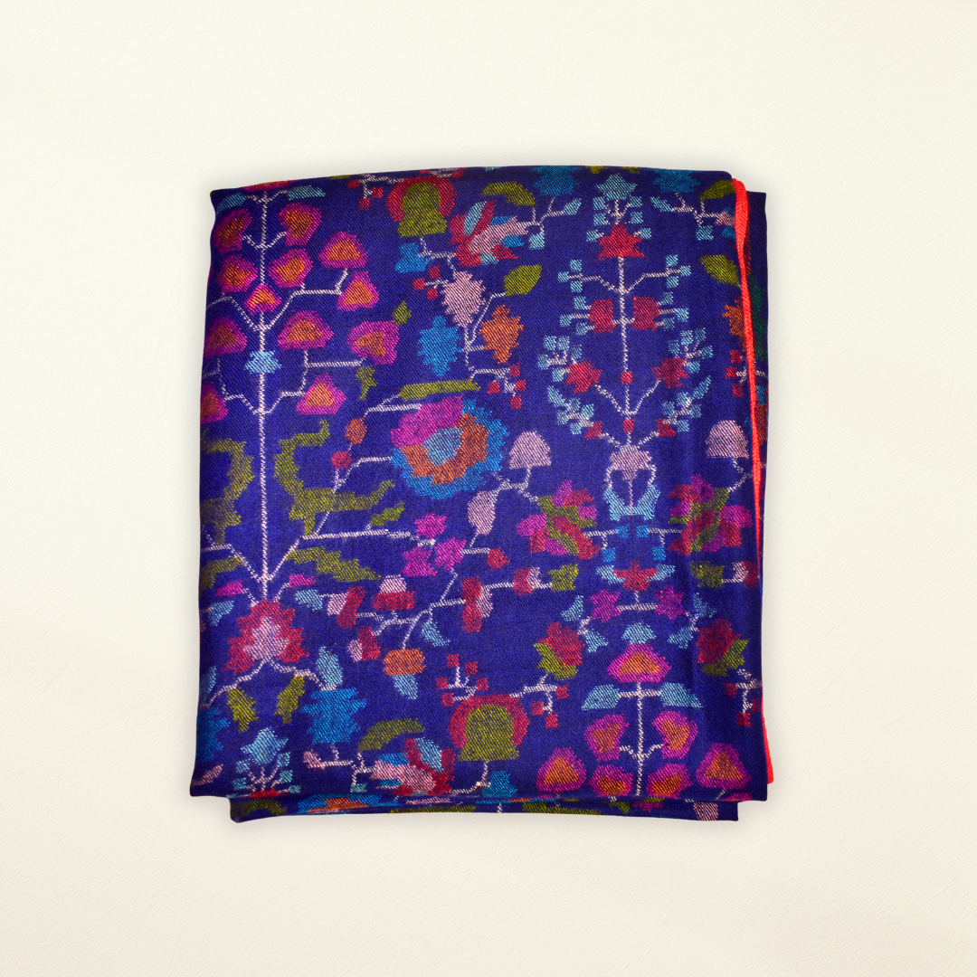 Folded Pashmina Shawl with colorful floral pattern on a white background