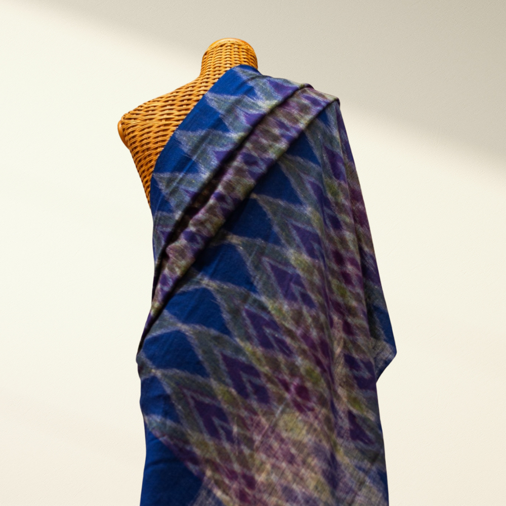Ikat Pashmina Shawl draped over a mannequin on a plain background