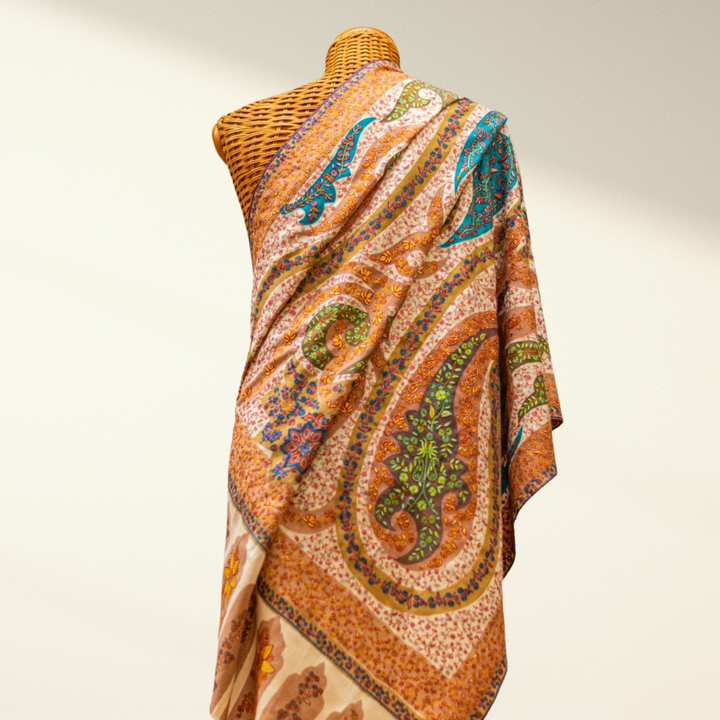 Jamawar Pashmina shawl draped over a mannequin on a plain background