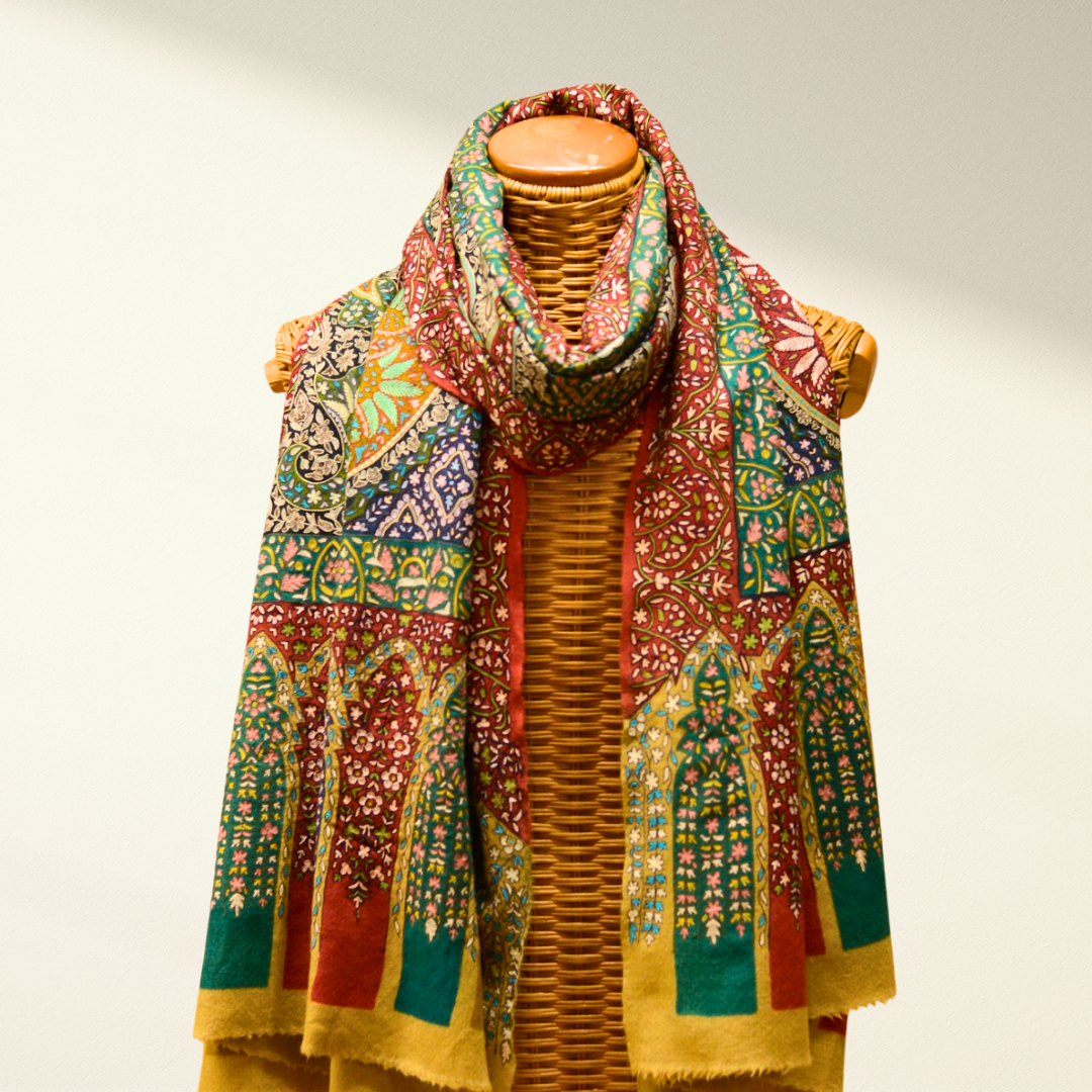 Mannequin wearing a jamwar pashmina scarf with a neutral background