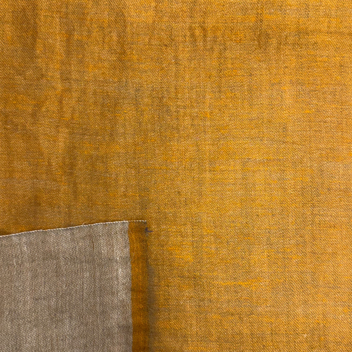 Close-up of a brown pashmina with a mix of brown and gray colors.