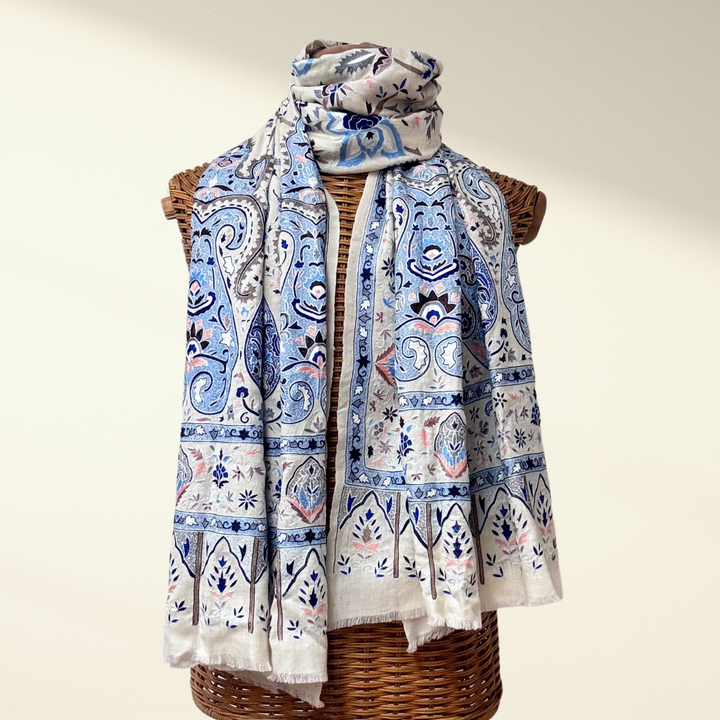Pashmina Shawl Boteh with blue and pink embroidery draped over a wicker mannequin on a beige background