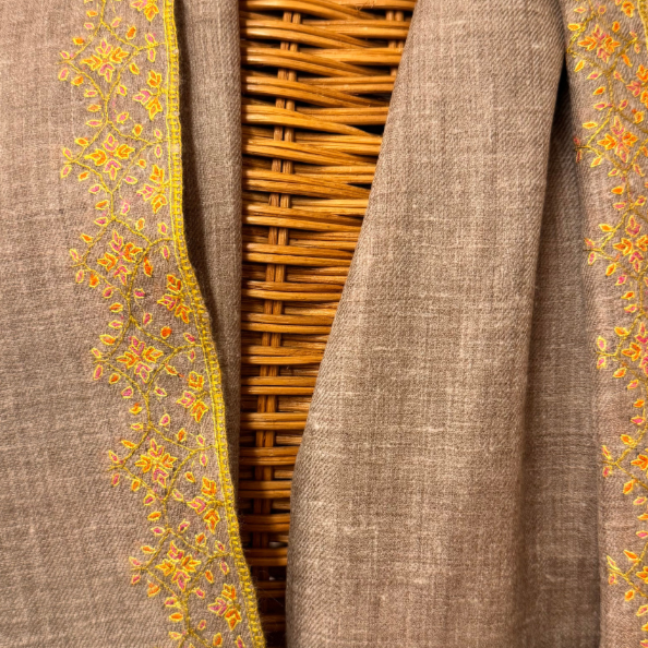 Dark natural Pashmina shawl with hand-embroidered floral corners, made from pure undyed wool.