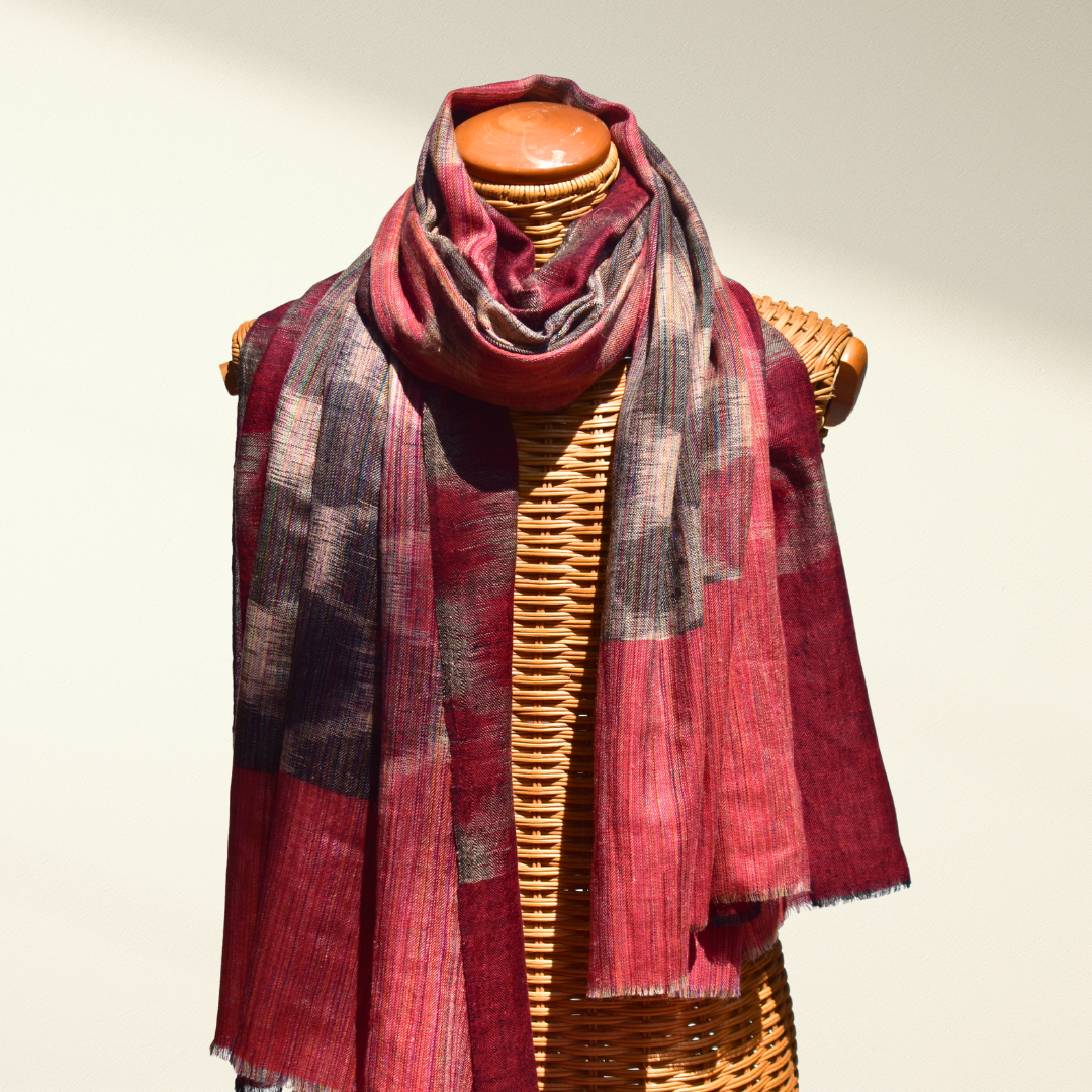 Pashmina shawl INA draped over a mannequin on a neutral background