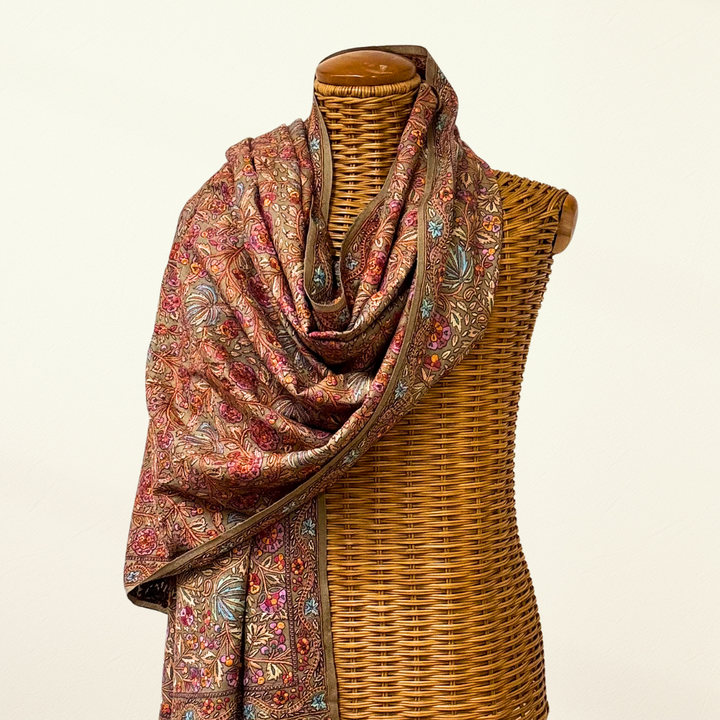 Pashmina shawl on a mannequin with a plain background