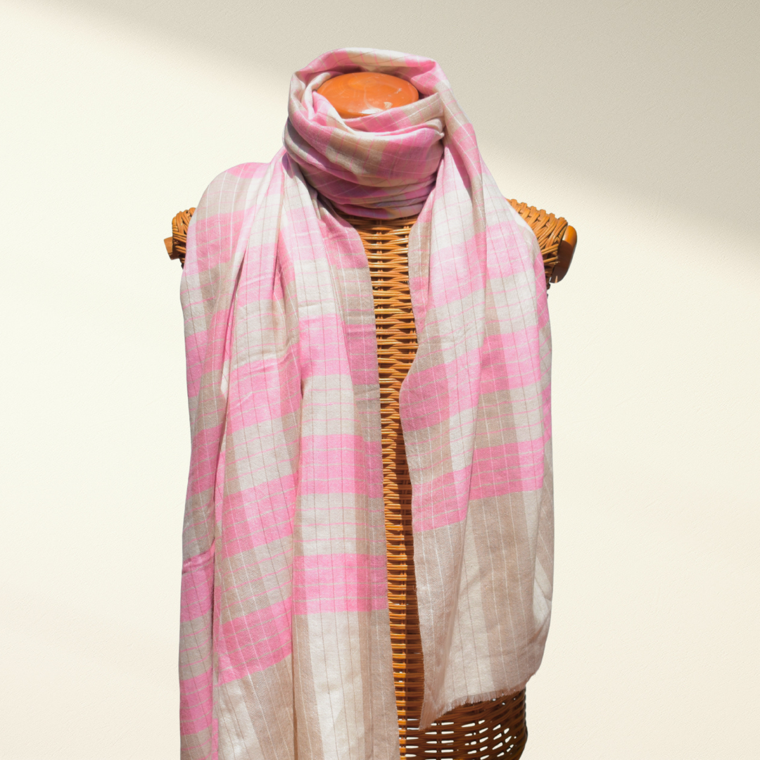 Pink and beige checkered pashmina scarf on a mannequin against a plain background