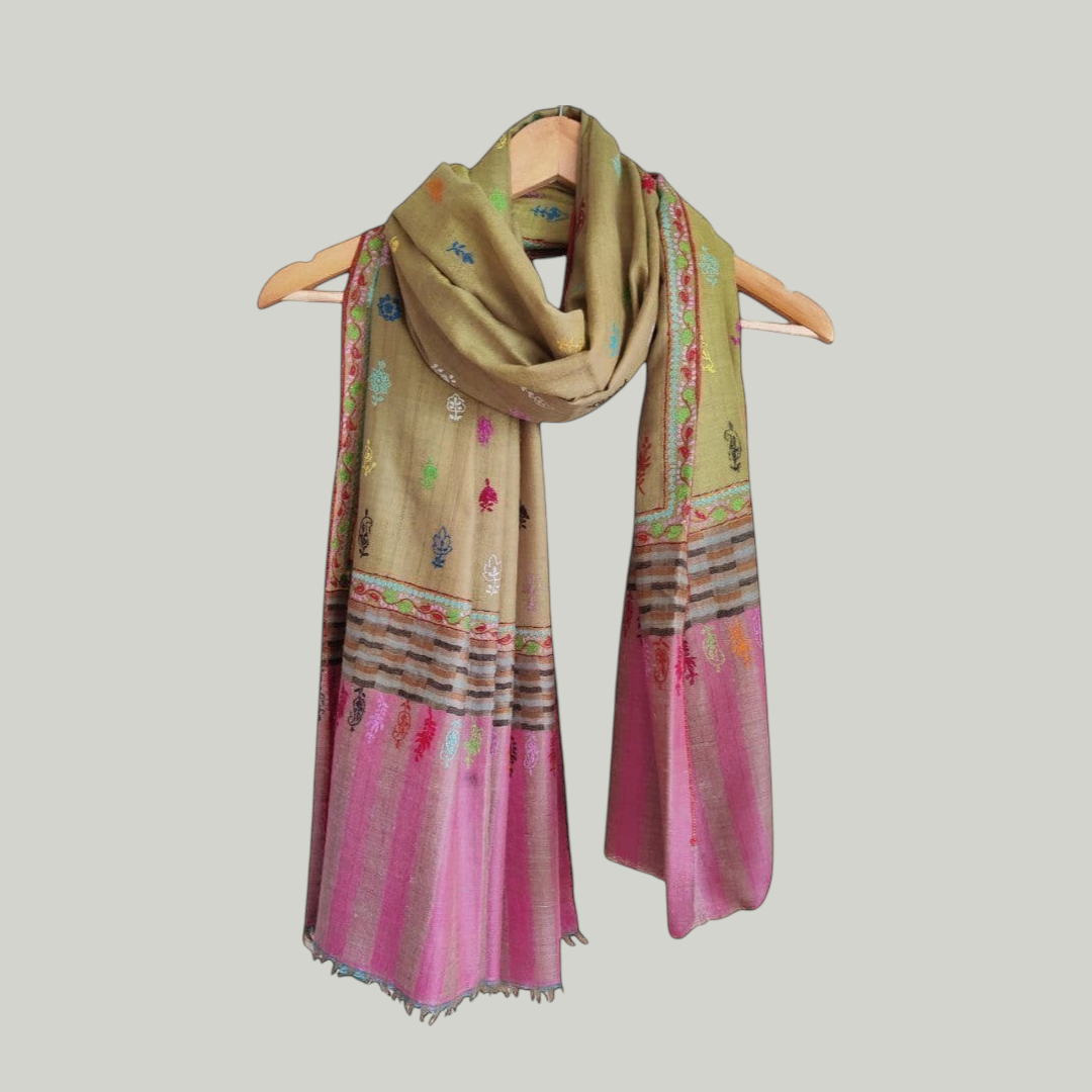 Blust olive Colorful scarf with intricate patterns on a hanger against a light background