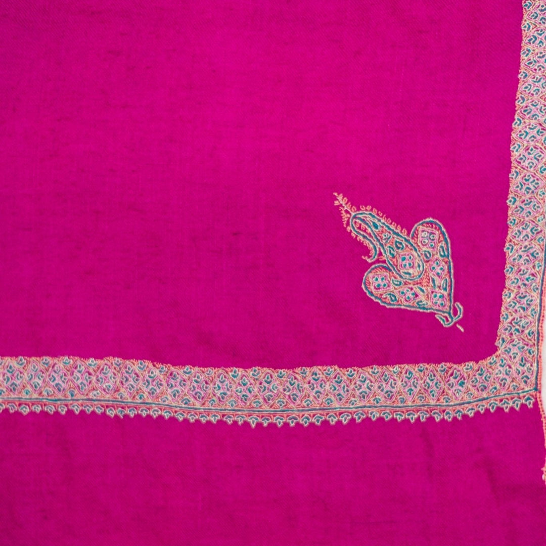 Pure cashmere scarf featuring rich magenta hue and handcrafted texture