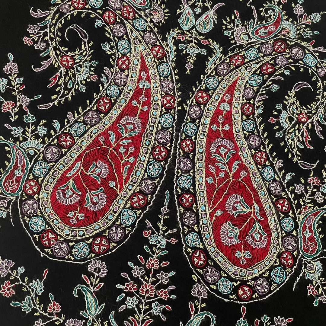 Black Pashmina shawl with paisley embroidery on all four corners.
