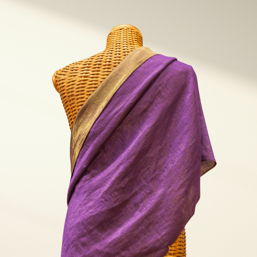 Purple metallic pashmina shawl draped over a mannequin with a beige background
