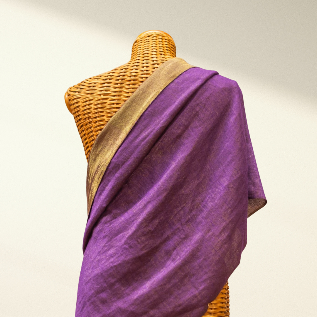 Purple metallic pashmina shawl draped over a mannequin with a beige background