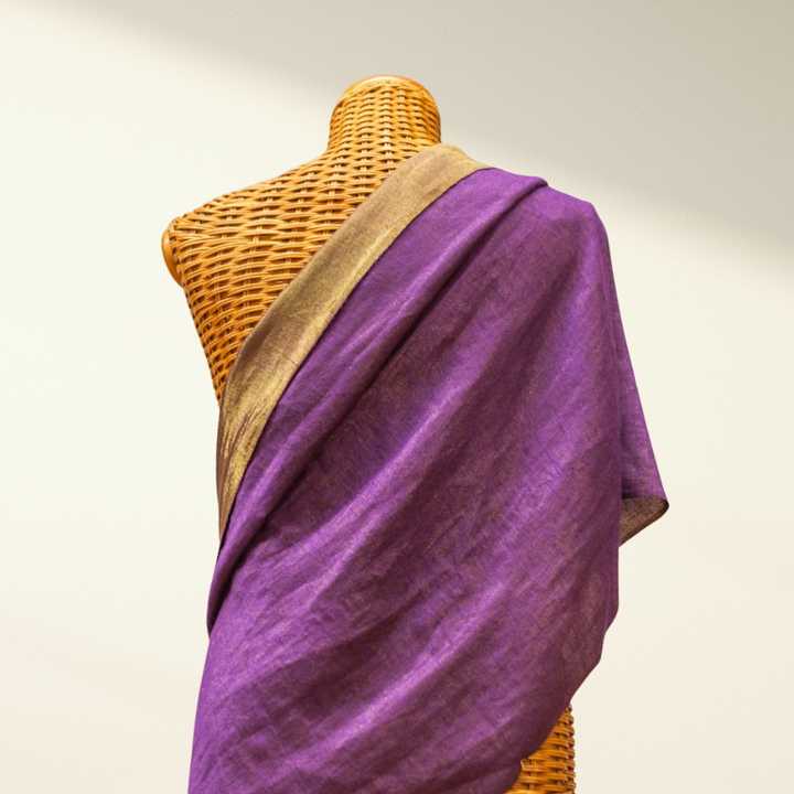 Purple metallic pashmina shawl draped over a mannequin with a beige background