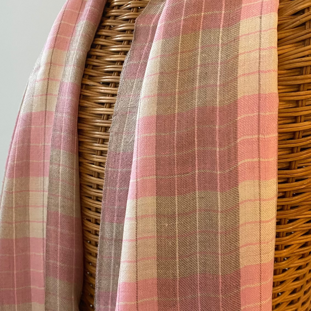 Reversible pink and white Pashmina shawl with modern checkered design draped on mannequin