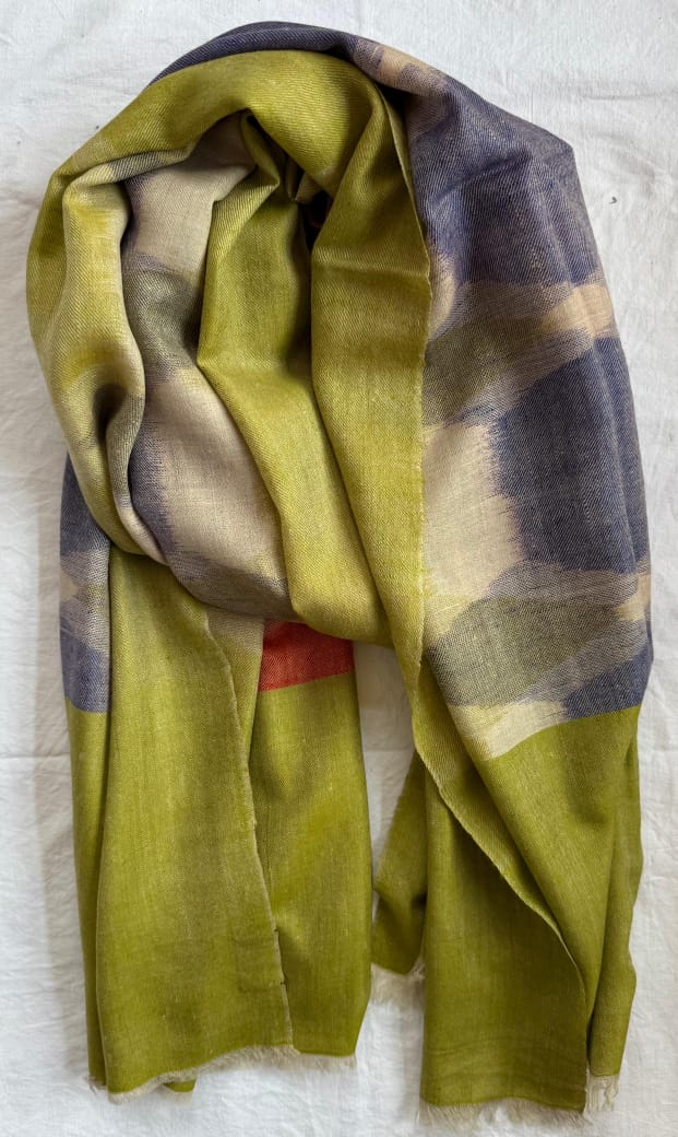 Plaid scarf with green, purple, beige, and red colors on a white background