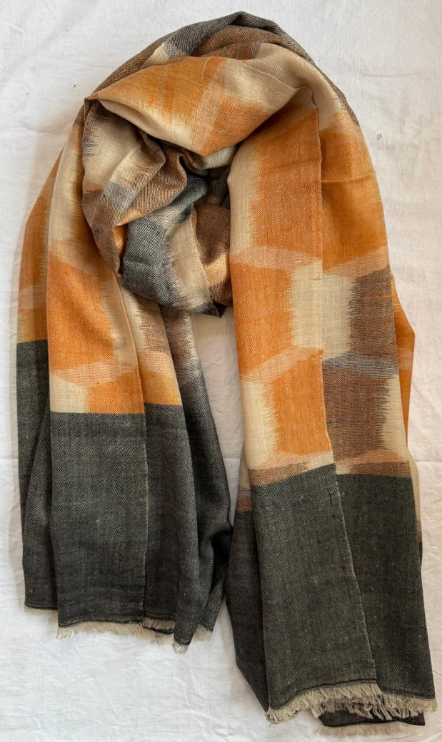 Plaid scarf with orange, beige, and gray colors on a white background