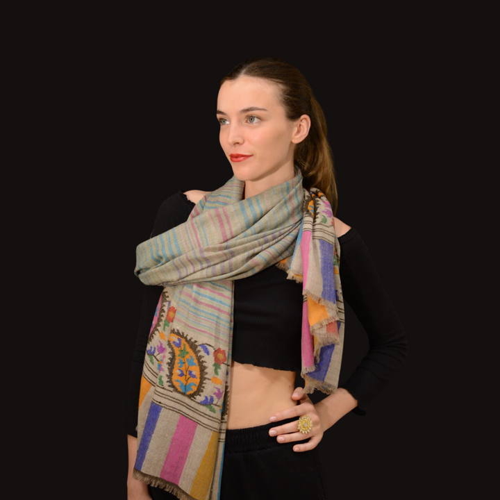 Woman wearing a pashmina shawl khadi on a black background