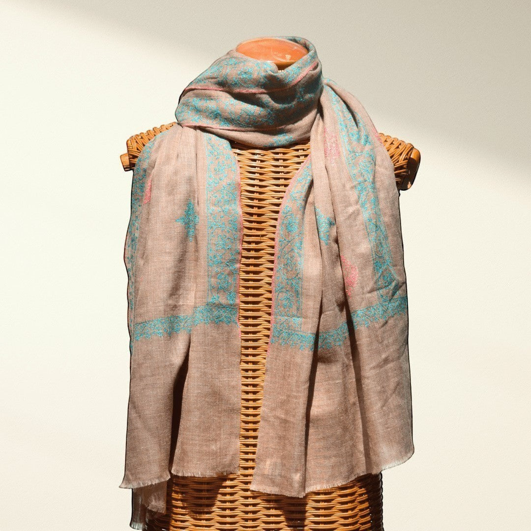 BLISS Pure Pashmina Shawl – Draped View of Natural Taupe Undyed Cashmere with Pink & Blue Sozni Embroidered Corners | Indus Weavers