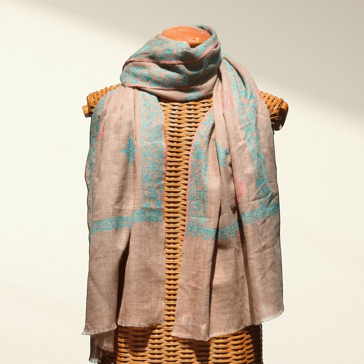 BLISS Pure Pashmina Shawl – Draped View of Natural Taupe Undyed Cashmere with Pink & Blue Sozni Embroidered Corners | Indus Weavers