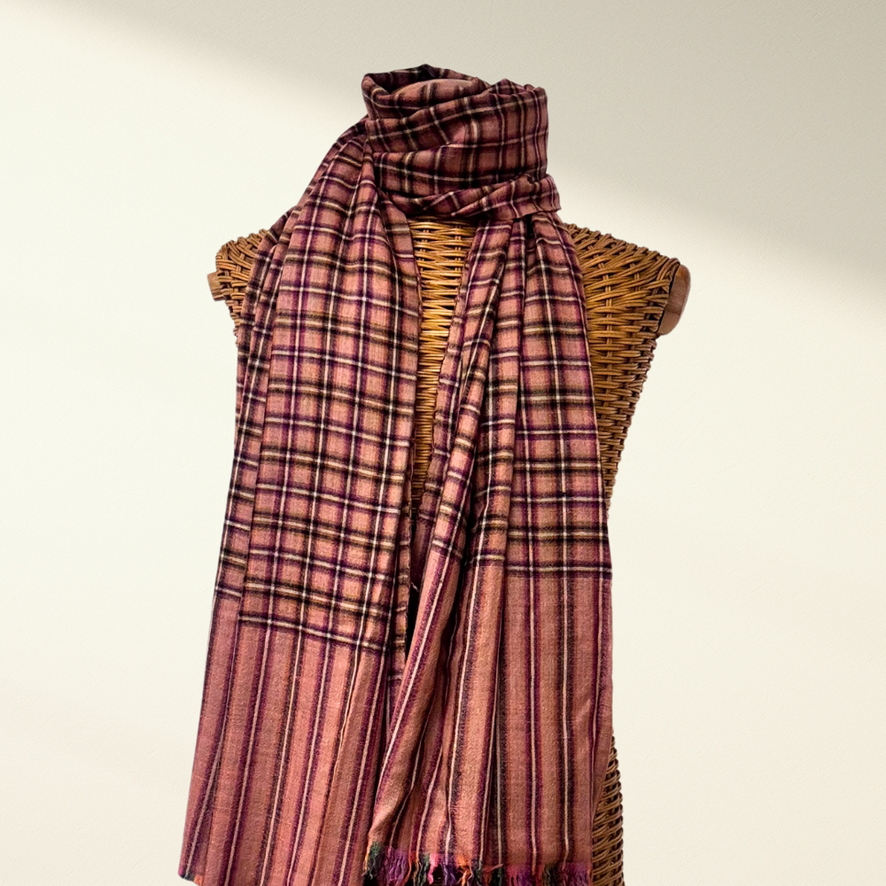 checkered pashmina scarf draped over a mannequin with a neutral background