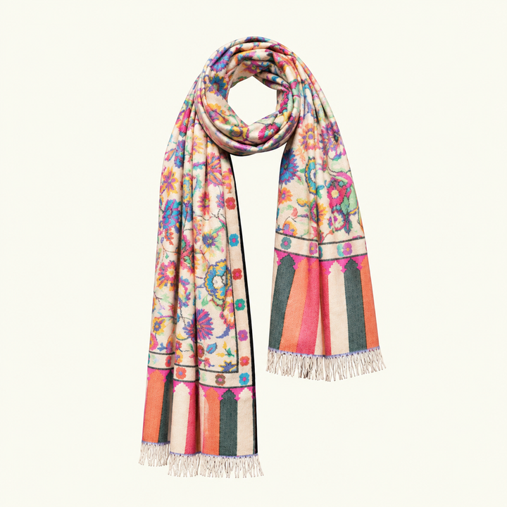 A multicolor floral and geometric patterned cashmere scarf with fringed ends, displayed on a clean off-white background.