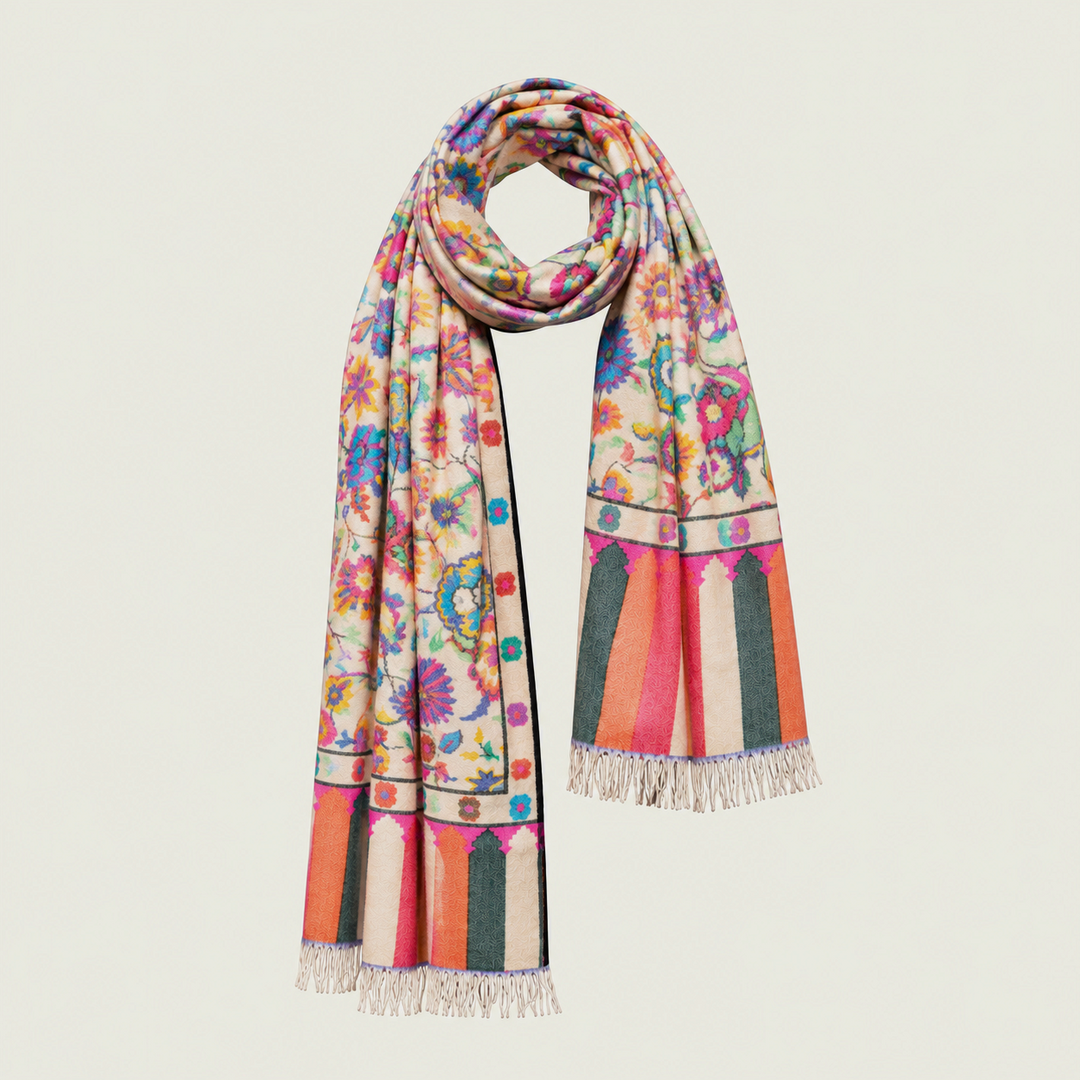 A multicolor floral and geometric patterned cashmere scarf with fringed ends, displayed on a clean off-white background.