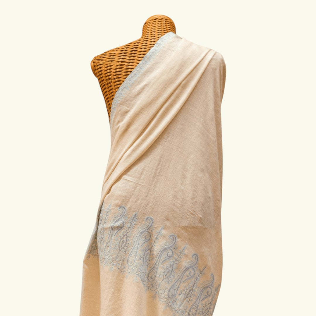 AQUA Pure Pashmina Shawl – Draped Lifestyle View Showing Ivory Base & Blue Sozni Embroidery Detail | Indus Weavers