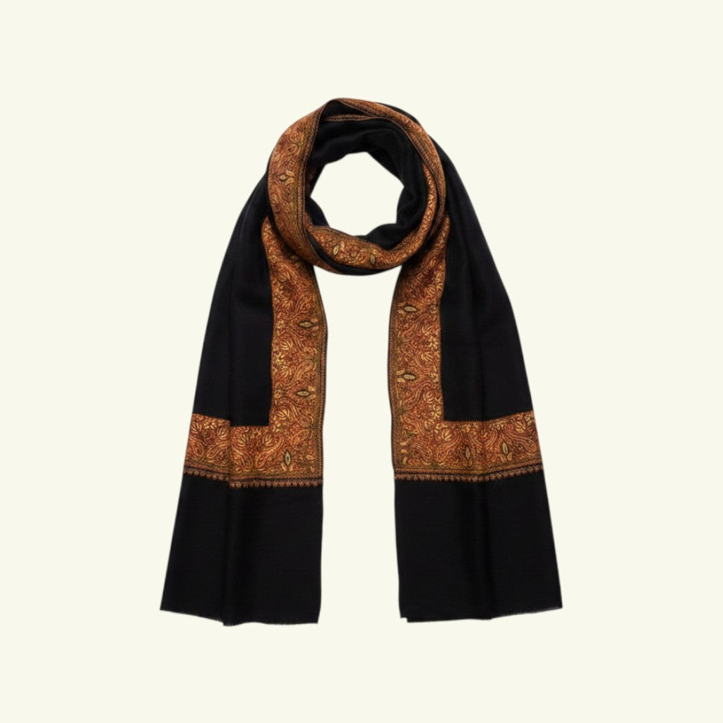 Indus Weavers black Merino cashmere shawl with intricate Sozni embroidery in warm earthy tones. Handwoven wrap.