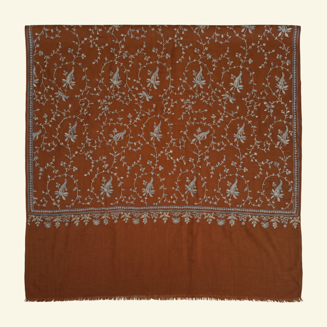 Indus Weavers TERRA brown Pashmina shawl with intricate ivory, blue, and sage floral Sozni embroidery in a Jaal pattern.