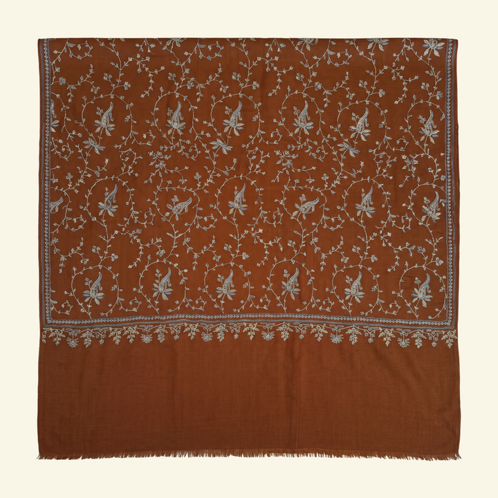 Indus Weavers TERRA brown Pashmina shawl with intricate ivory, blue, and sage floral Sozni embroidery in a Jaal pattern.