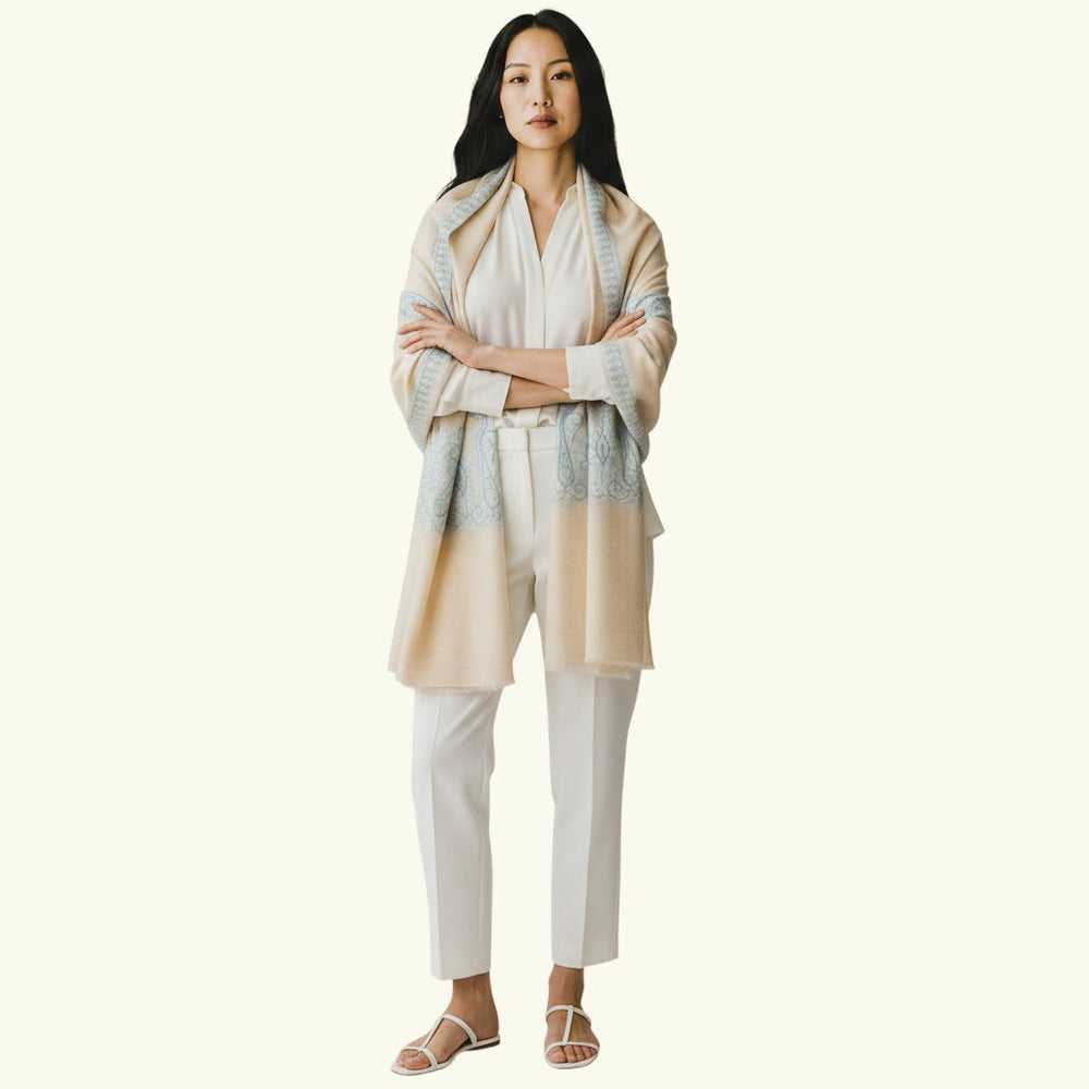 Indus Weavers ivory pashmina shawl with blue Sozni embroidery in paisley motifs. Handwoven cashmere wrap.