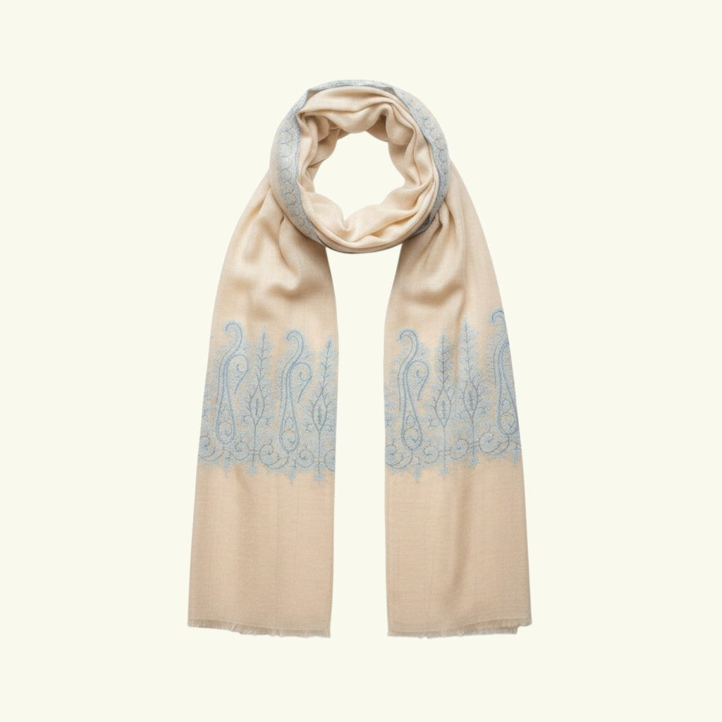 Indus Weavers ivory pure Kashmiri pashmina shawl with blue Sozni embroidered paisley motifs. Handwoven cashmere wrap.