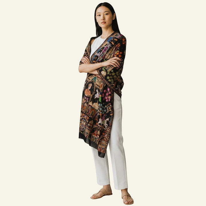 Indus Weavers black pashmina shawl with multicolour Kalamkari embroidery of horses, elephants, and Mughal architecture.