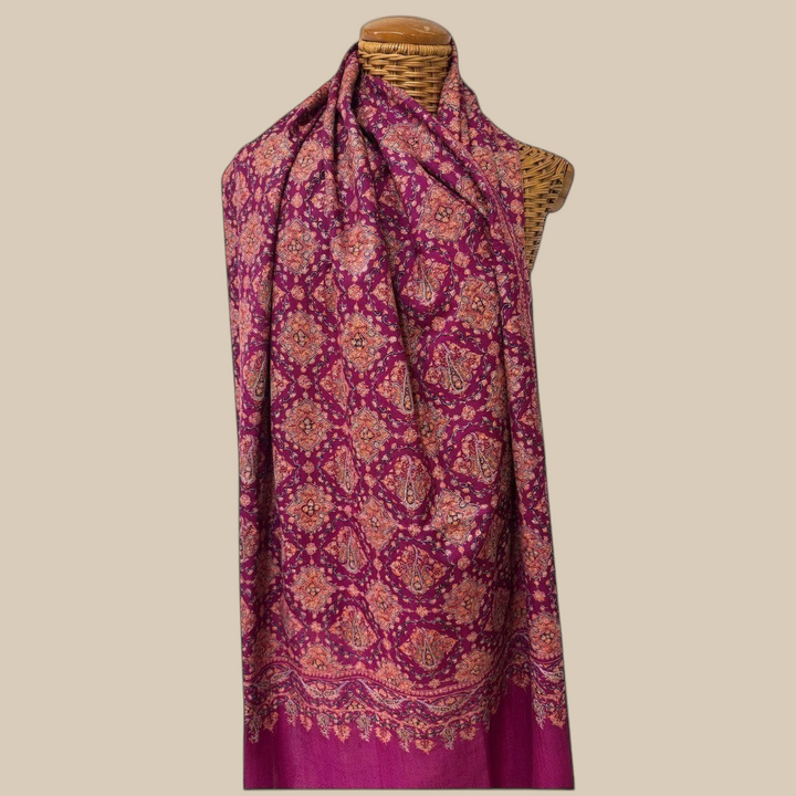 Indus Weavers GULNAR handwoven pure Kashmiri Pashmina shawl in deep magenta with intricate Sozni embroidery in pink and orange.