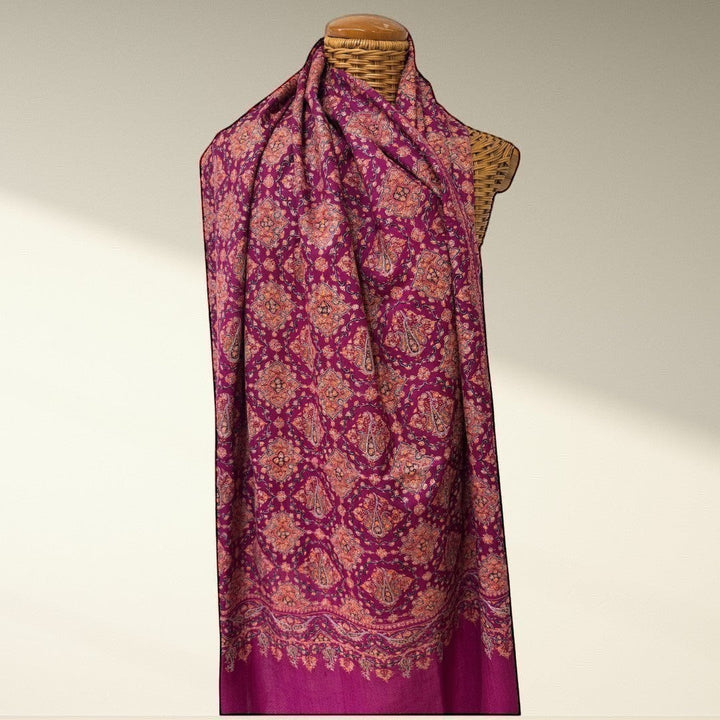 Indus Weavers GULNAR handwoven pure Kashmiri Pashmina shawl in deep magenta with intricate Sozni embroidery in pink and orange.