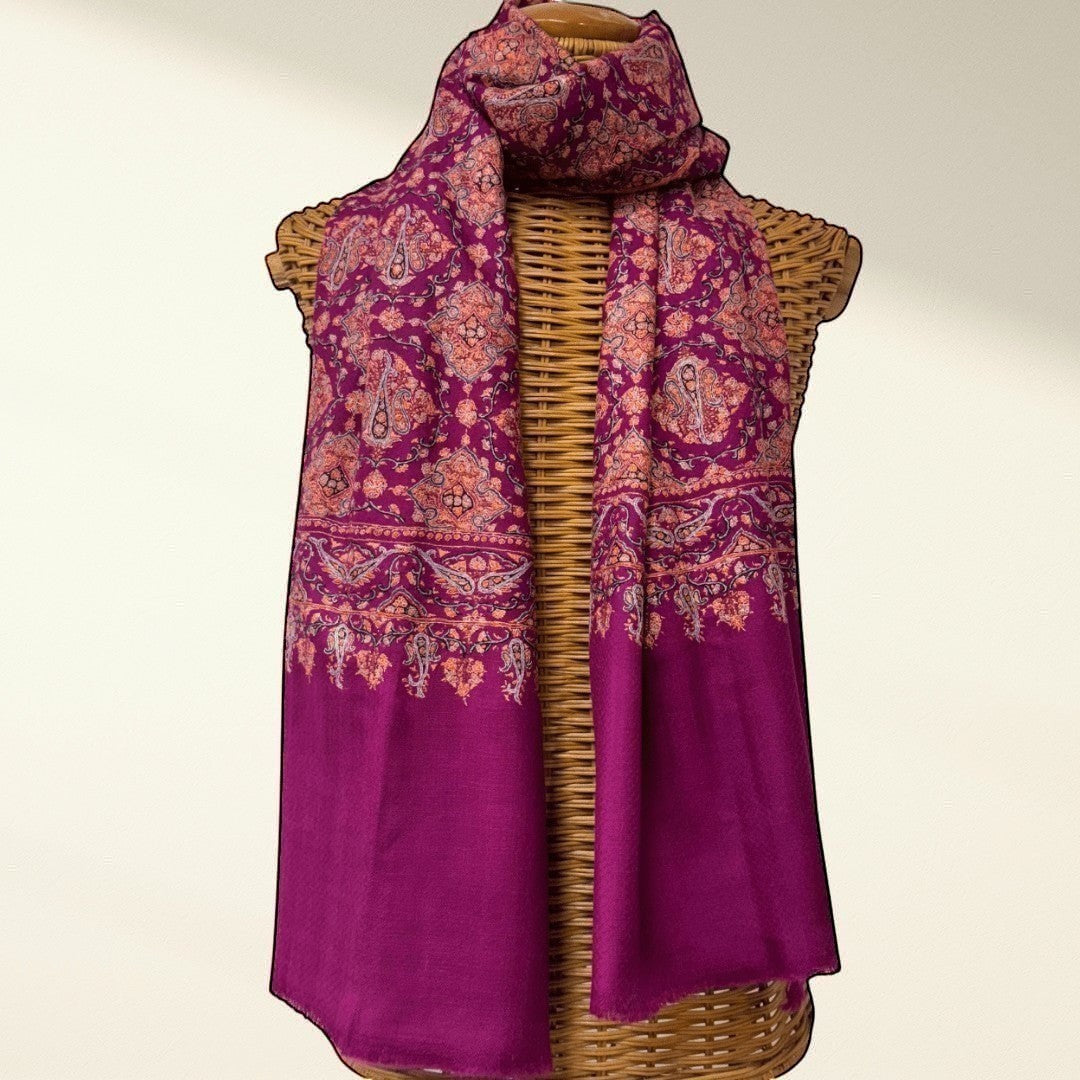 Indus Weavers GULNAR handwoven pure Kashmiri pashmina shawl in deep magenta with intricate paisley and floral Sozni embroidery in pink and orange.