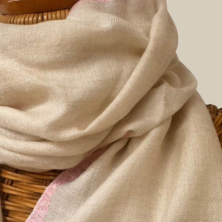 BEAU Handwoven Pashmina Stole – Close-Up of Delicate Pink Embroidery & Silver Zari Border on White Cashmere | Indus Weavers