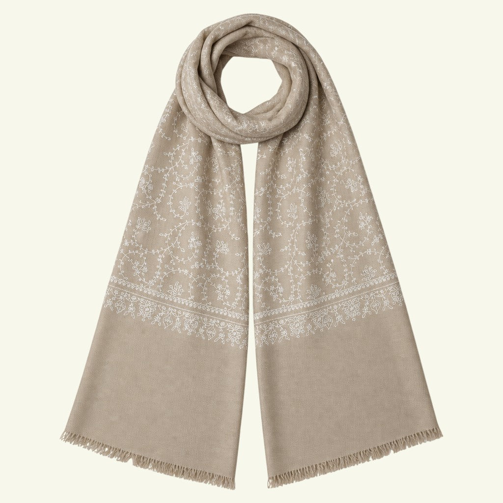 Indus Weavers taupe pashmina shawl with intricate ivory white floral Sozni embroidery and delicate fringed edges.