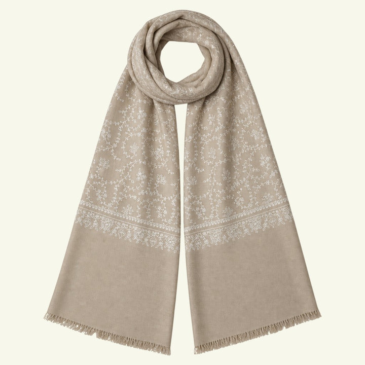 Indus Weavers taupe pashmina shawl with intricate ivory white floral Sozni embroidery and delicate fringed edges.