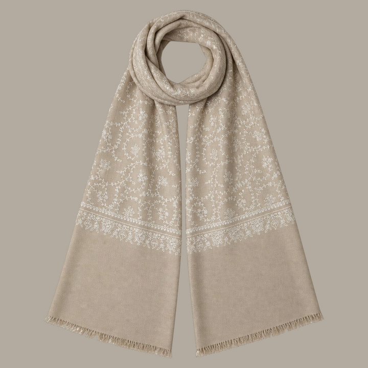 Indus Weavers taupe pashmina shawl with intricate ivory white floral Sozni embroidery and delicate fringed edges.