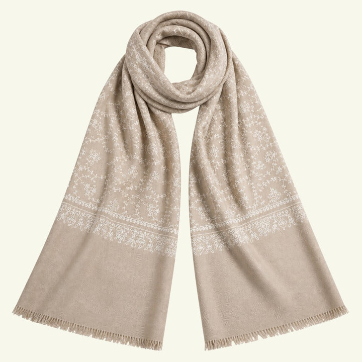Indus Weavers taupe pashmina shawl with intricate ivory white floral Sozni embroidery and delicate fringed edges.