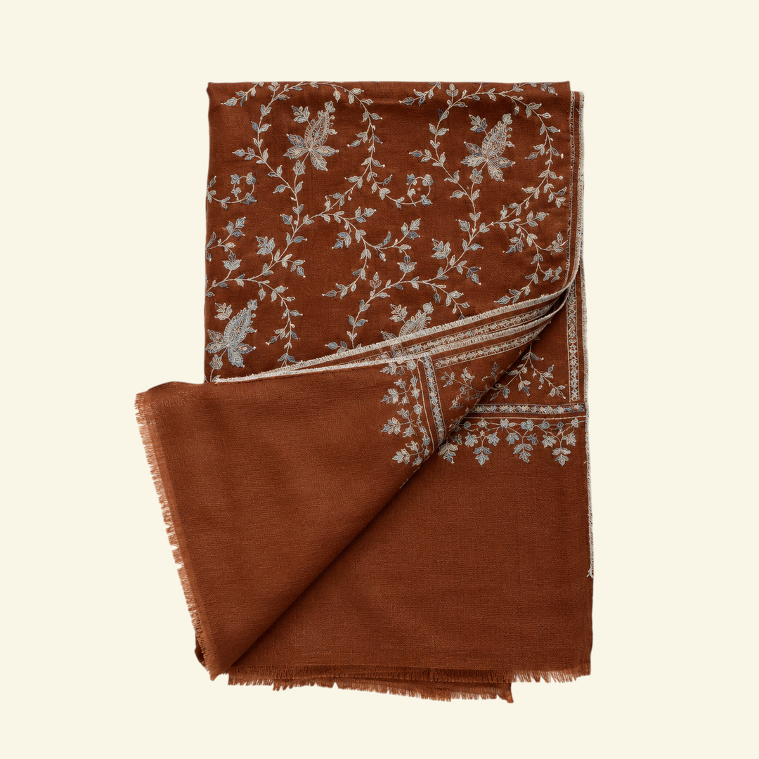 Indus Weavers TERRA brown Pashmina shawl with intricate ivory, blue, and sage floral Sozni embroidery in a Jaal pattern.