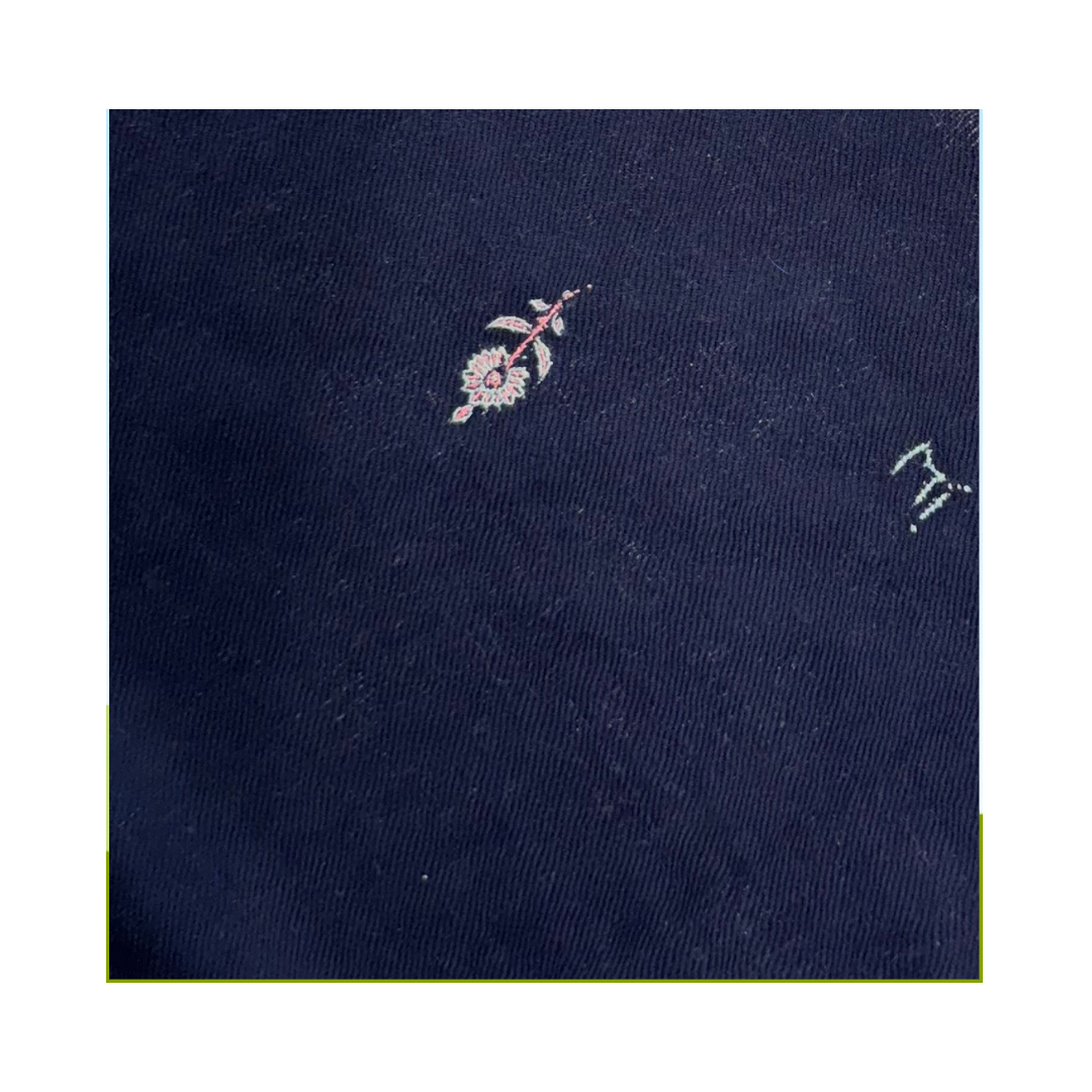 Midnight garden foulard closeup with floral embroidery in white and pink on midnight navy blue pashmina fabric.