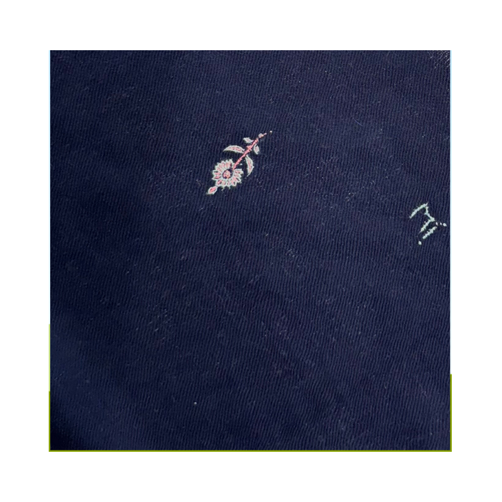 Midnight garden foulard closeup with floral embroidery in white and pink on midnight navy blue pashmina fabric.