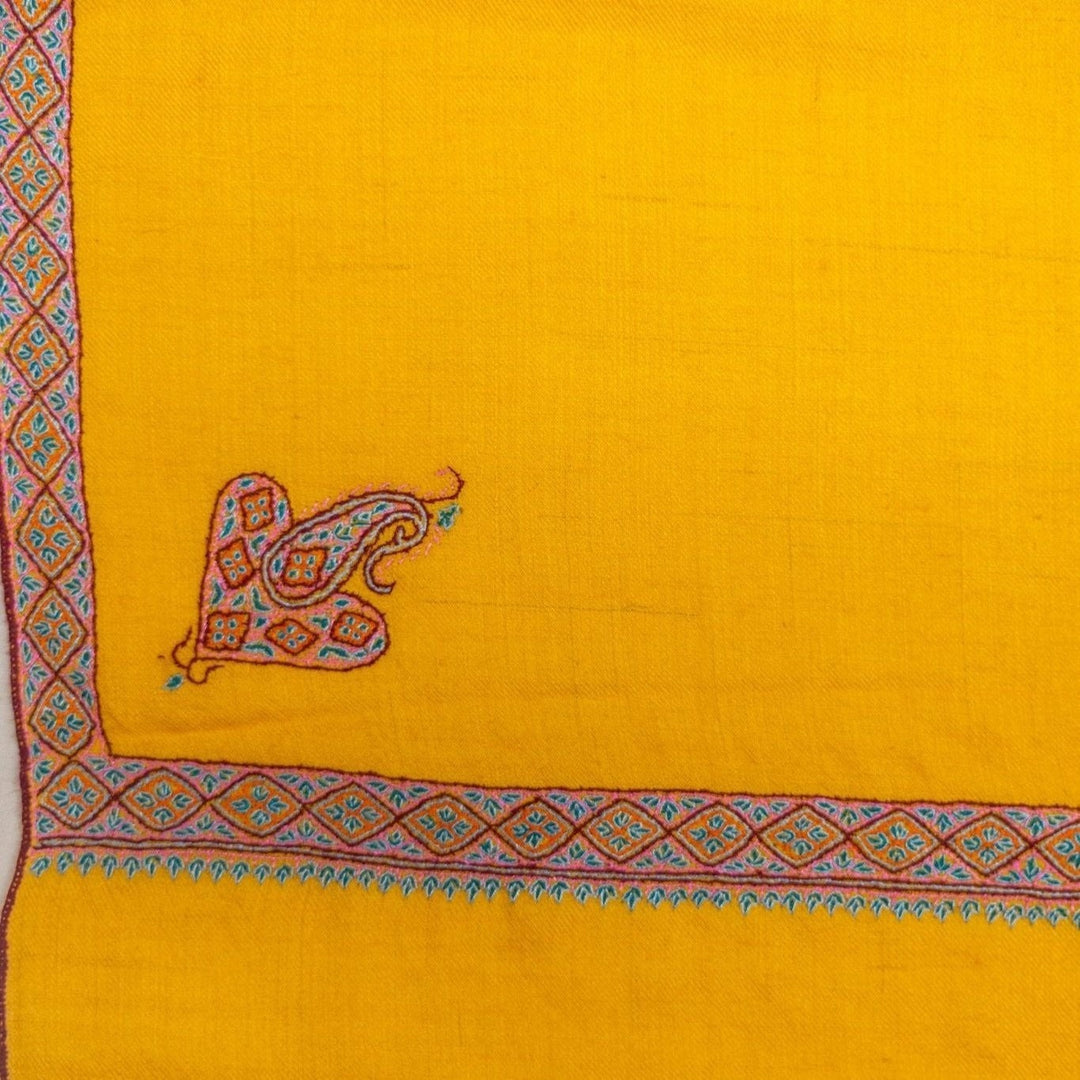 PILA Handwoven Kashmiri Pashmina – Draped Lifestyle View of Soft Yellow Hashidaar Sozni Embroidered Cashmere Wrap | Indus Weavers
