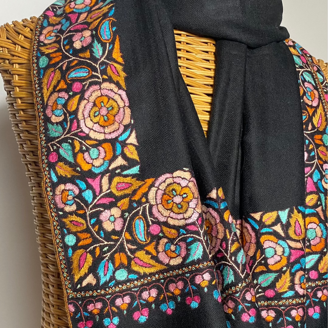 Black Pashmina shawl with bright floral Papier Mache embroidery on all borders draped on mannequin